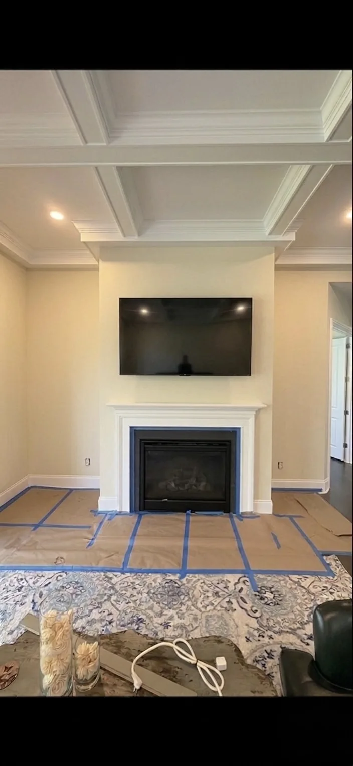 Plain fireplace and television wall before the accent wall installation