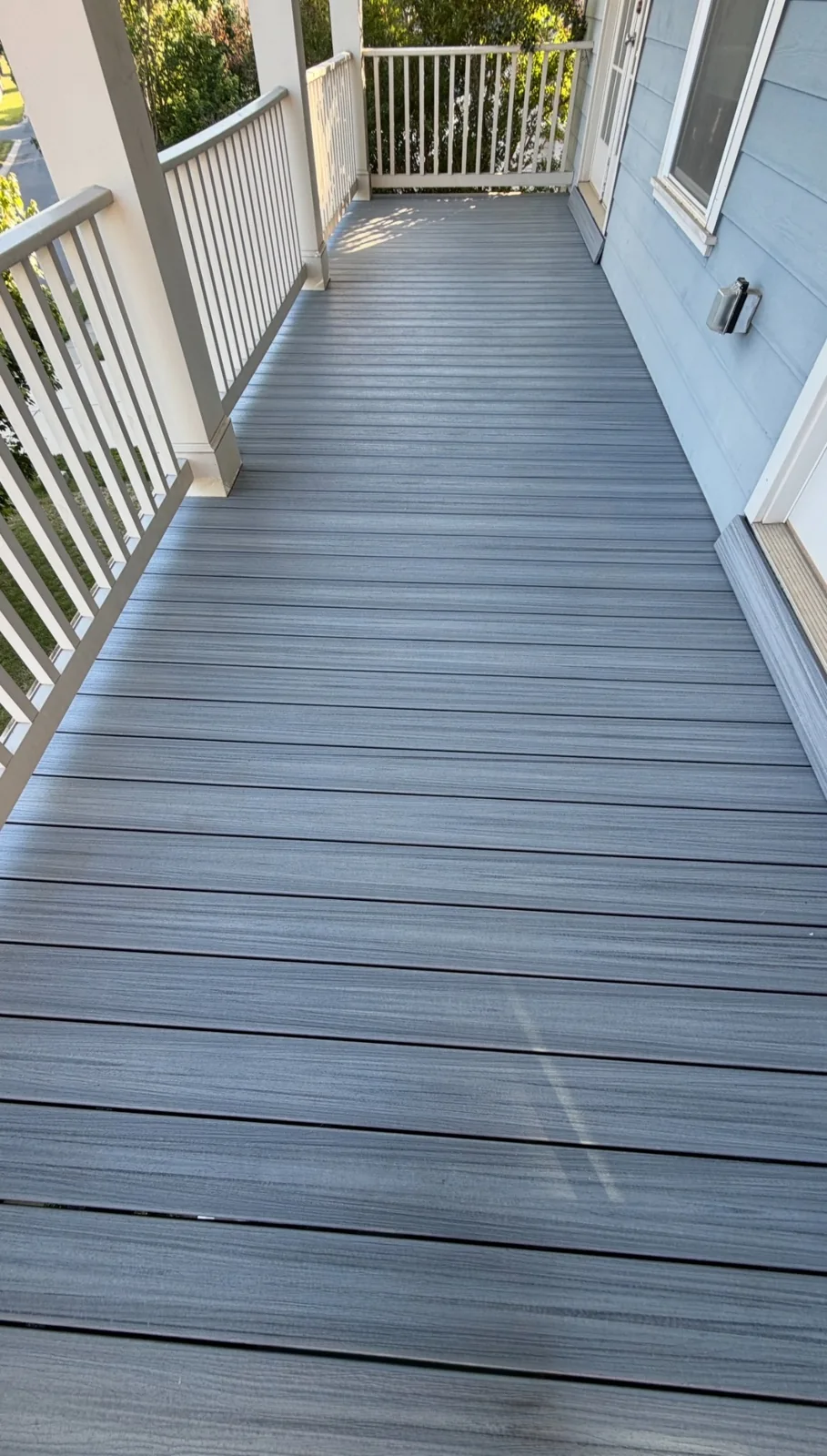 Upper-level deck with new gray deck boards