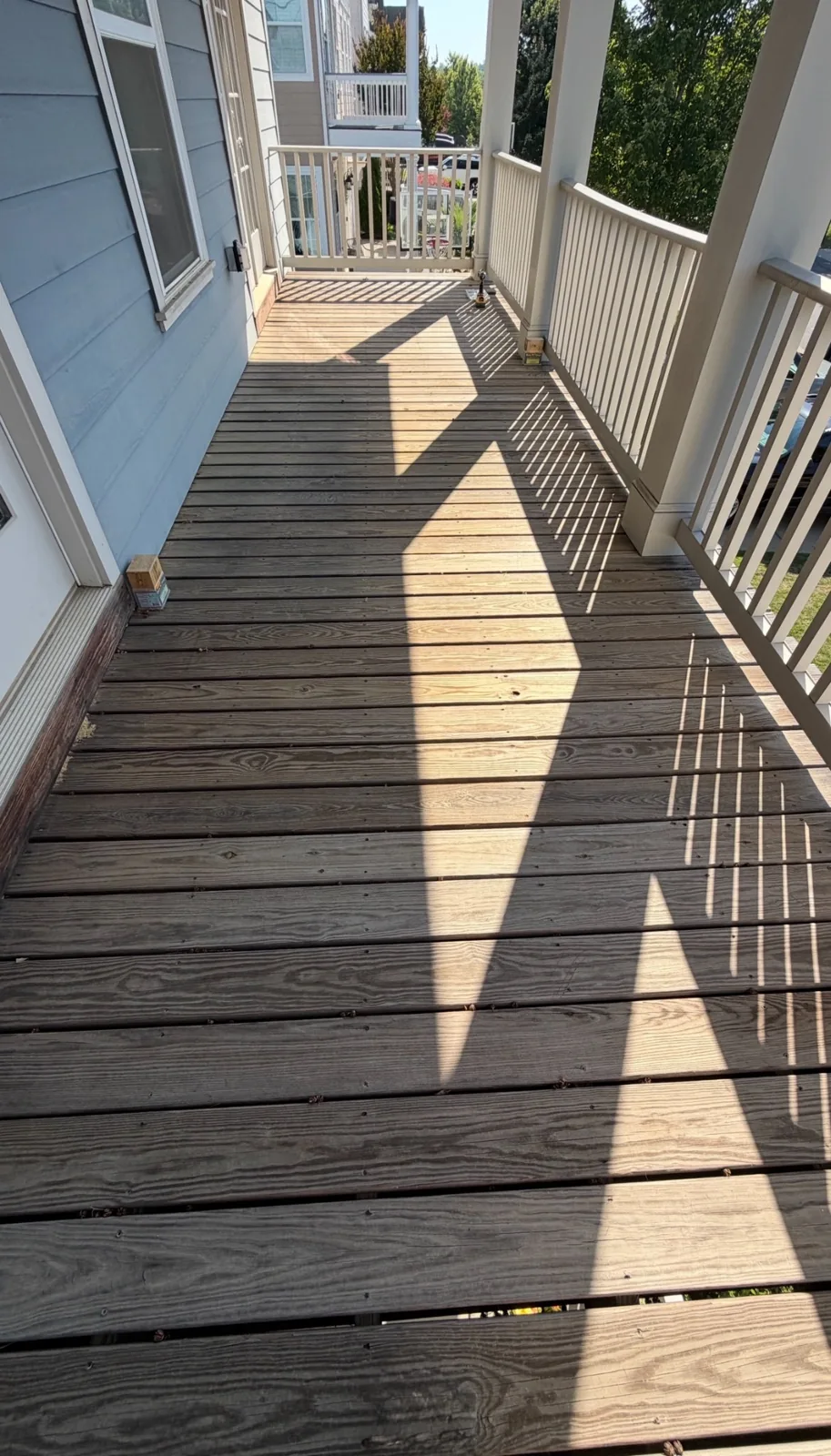 Weathered wood boards on an upper-level deck
